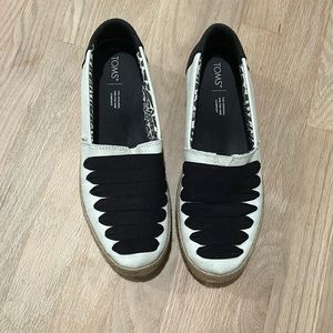 Tom’s black and white platform slip on shoes